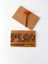 mid-century wooden peg board toy