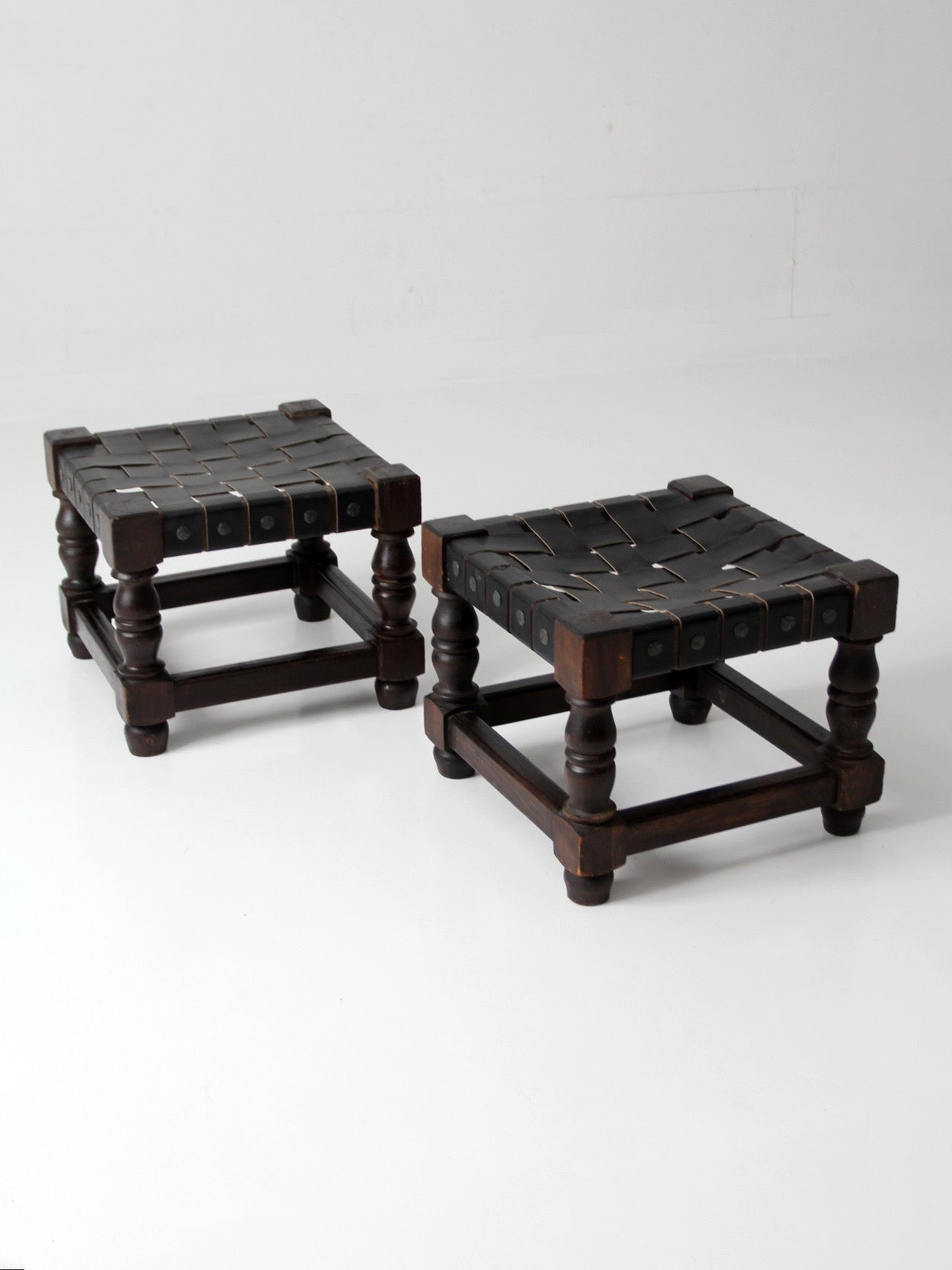 mid-century Spanish Revival leather strap stools pair