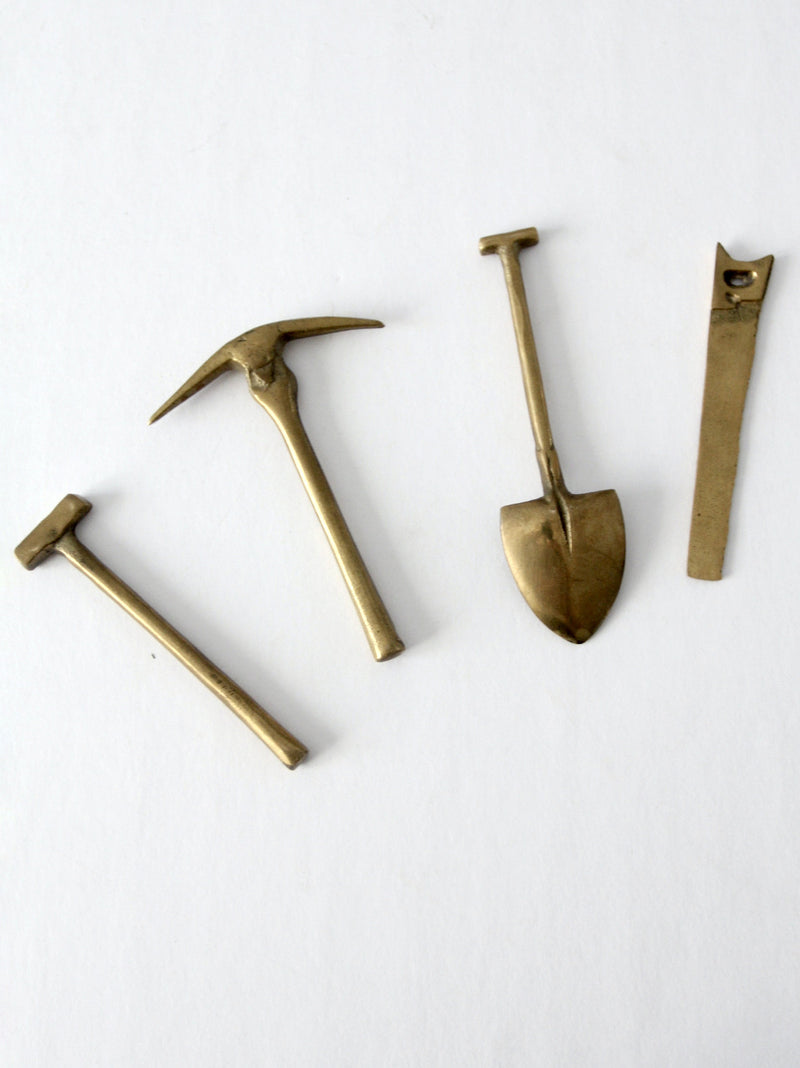 mid-century mini figurative brass tool set