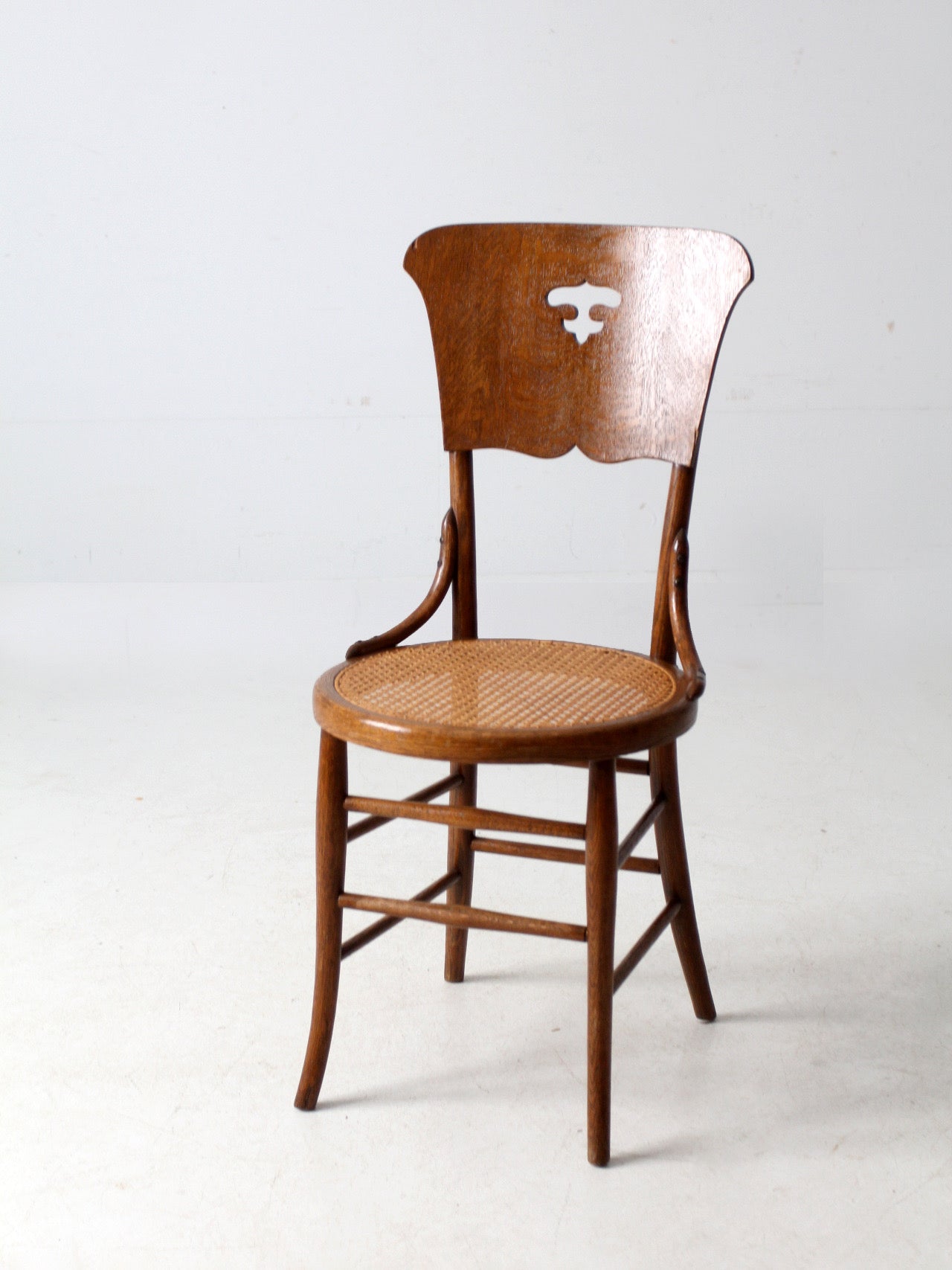 early 1900s bentwood chair with caned seat