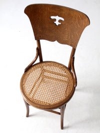 early 1900s bentwood chair with caned seat