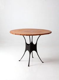 mid-century leather and iron round dining table
