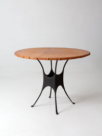 mid-century leather and iron round dining table