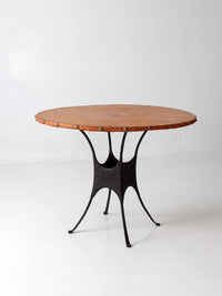 mid-century leather and iron round dining table