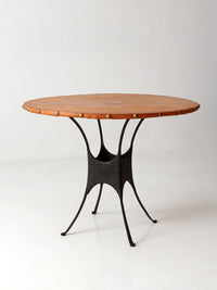 mid-century leather and iron round dining table