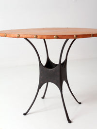 mid-century leather and iron round dining table