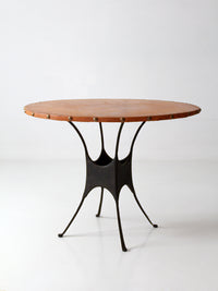 mid-century leather and iron round dining table