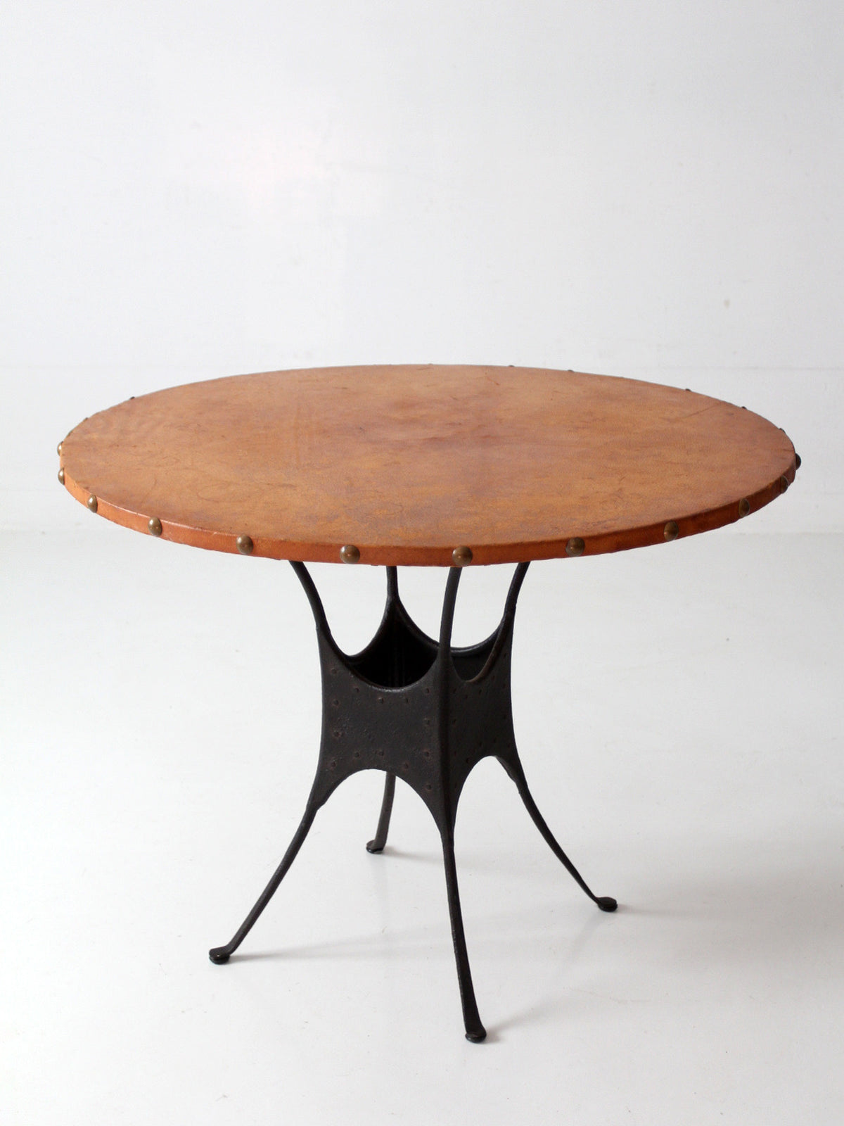 mid-century leather and iron round dining table