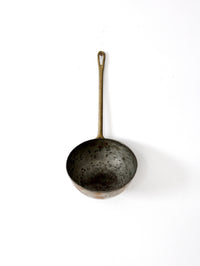 antique copper saucepan with brass handle