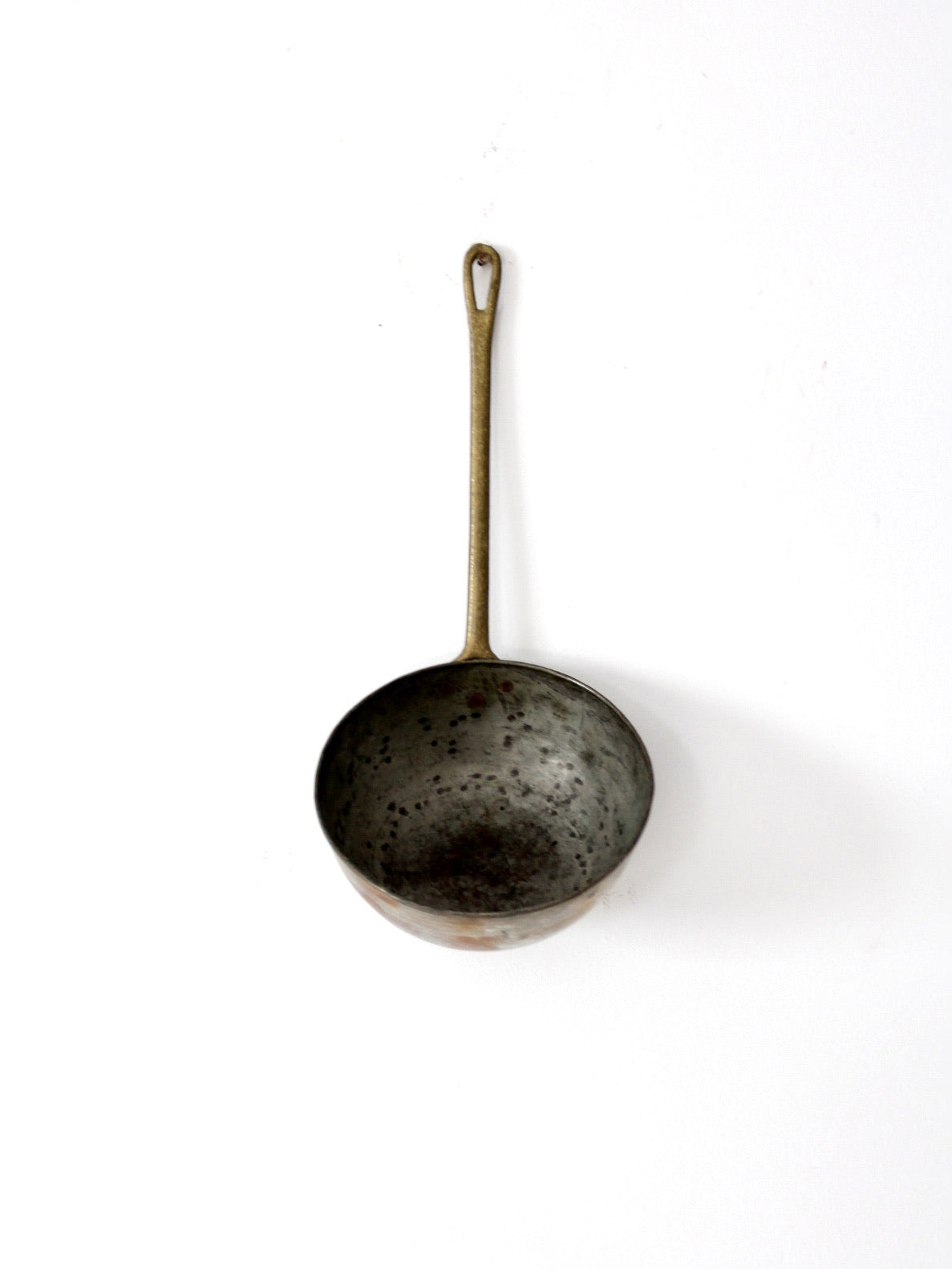 antique copper saucepan with brass handle