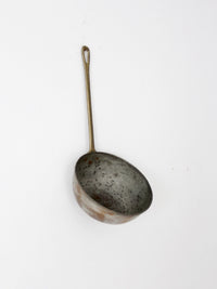 antique copper saucepan with brass handle