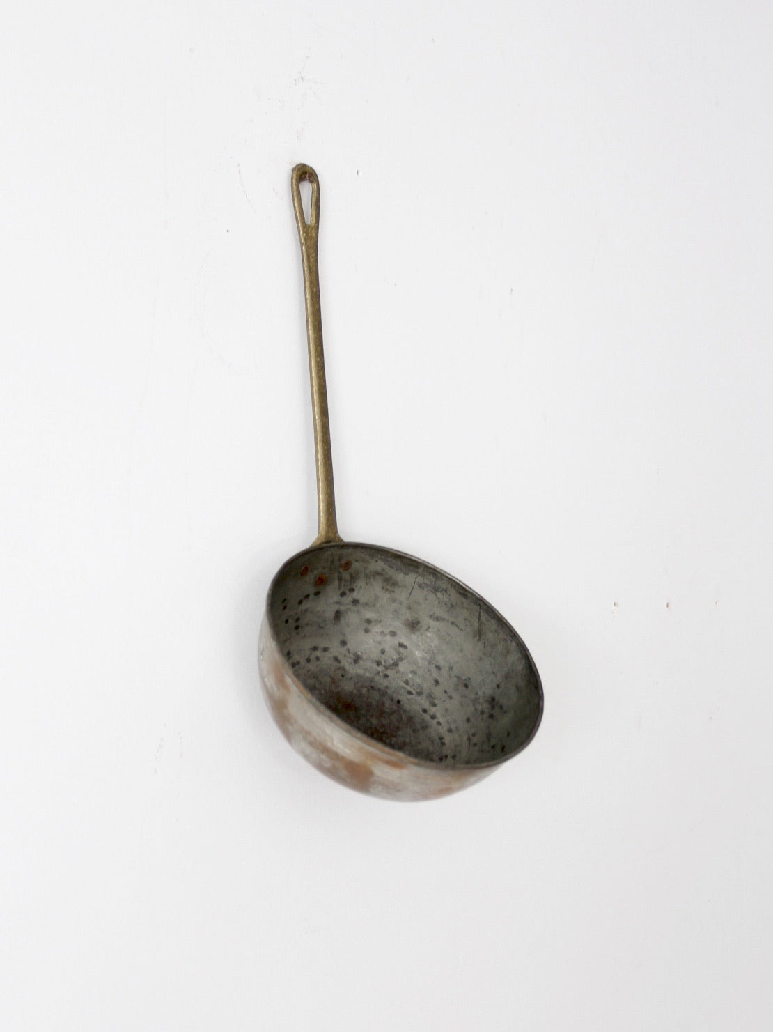 antique copper saucepan with brass handle