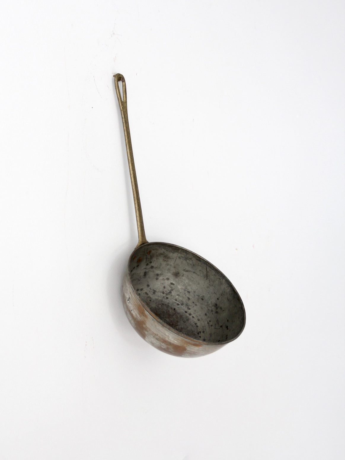 antique copper saucepan with brass handle