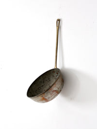 antique copper saucepan with brass handle