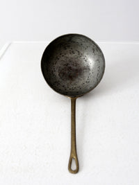antique copper saucepan with brass handle