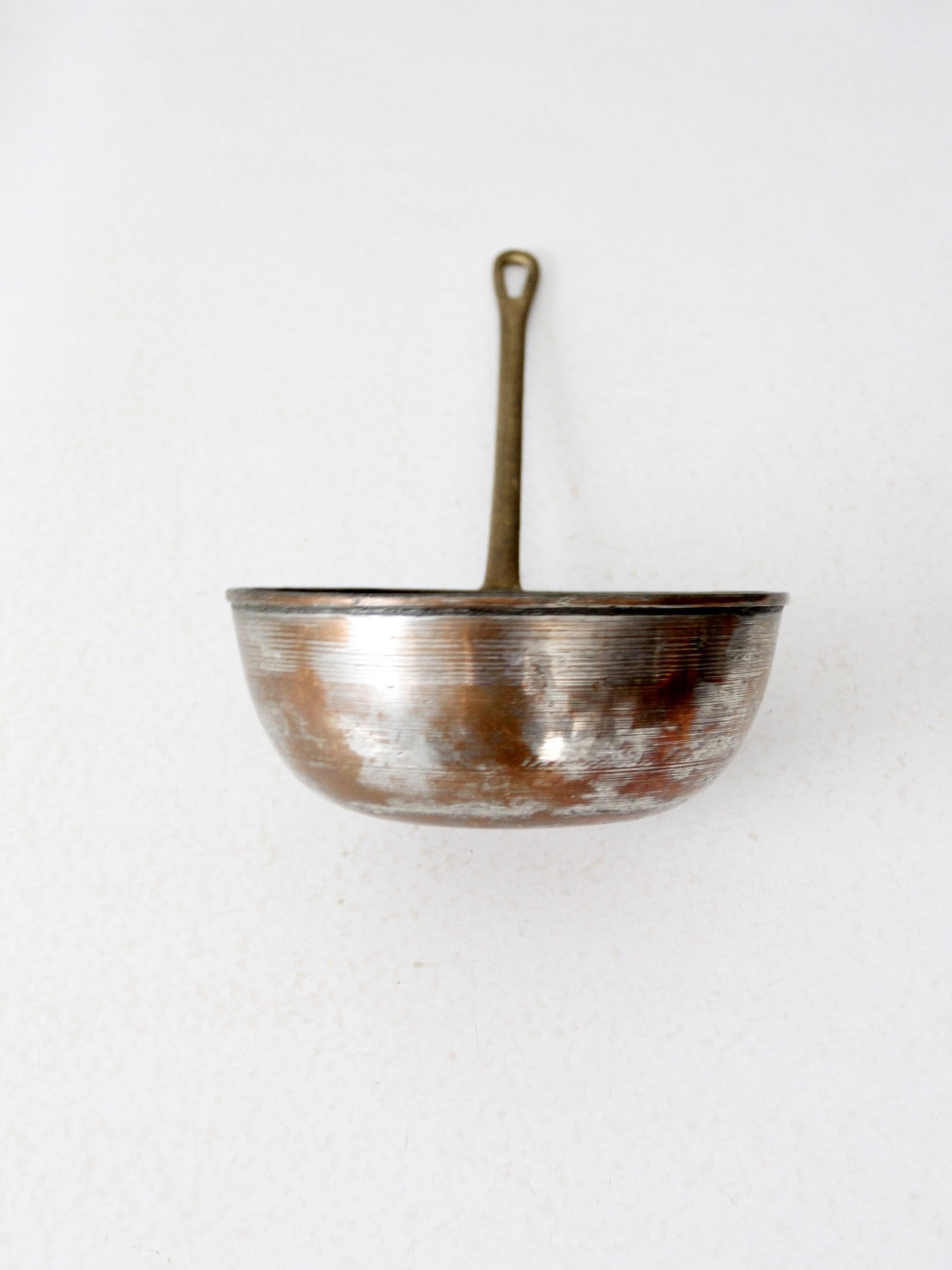 antique copper saucepan with brass handle