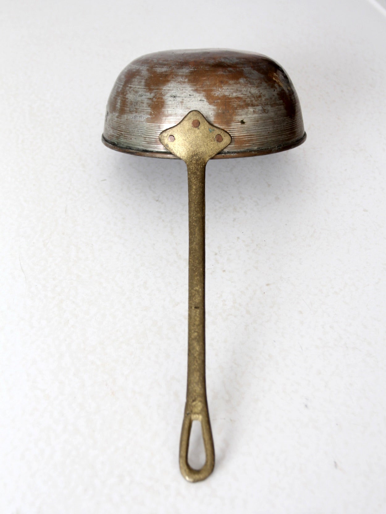 antique copper saucepan with brass handle