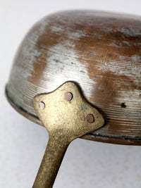 antique copper saucepan with brass handle