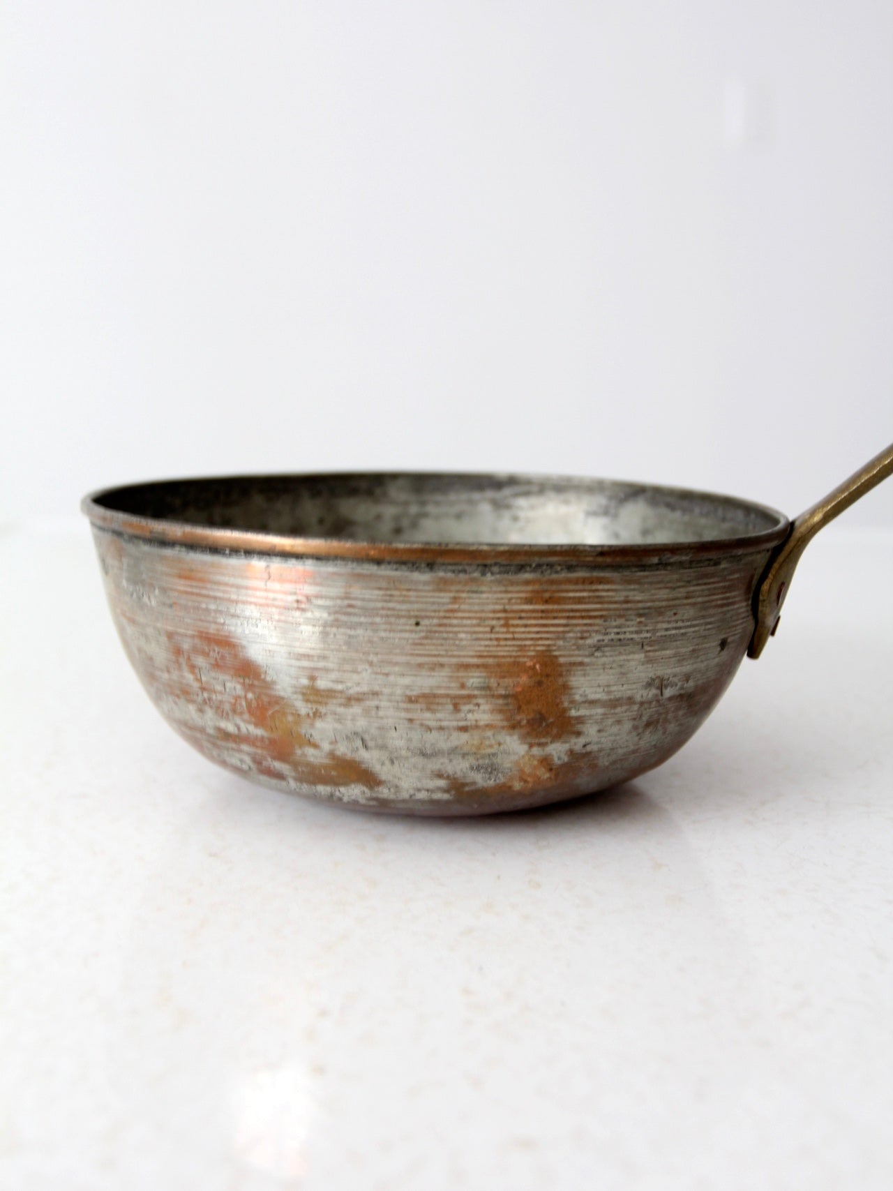 antique copper saucepan with brass handle