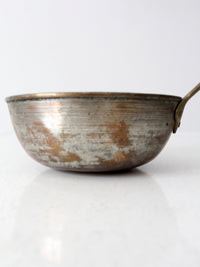 antique copper saucepan with brass handle