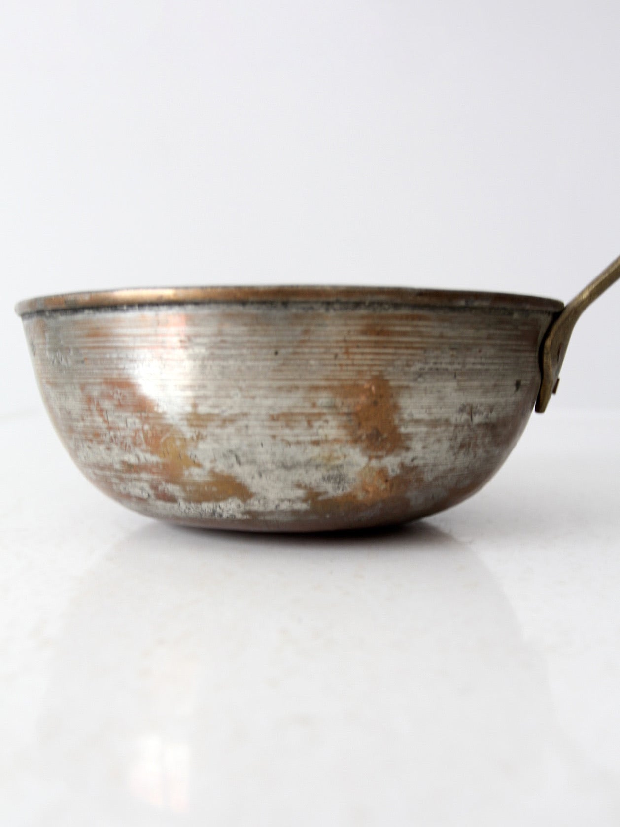 antique copper saucepan with brass handle
