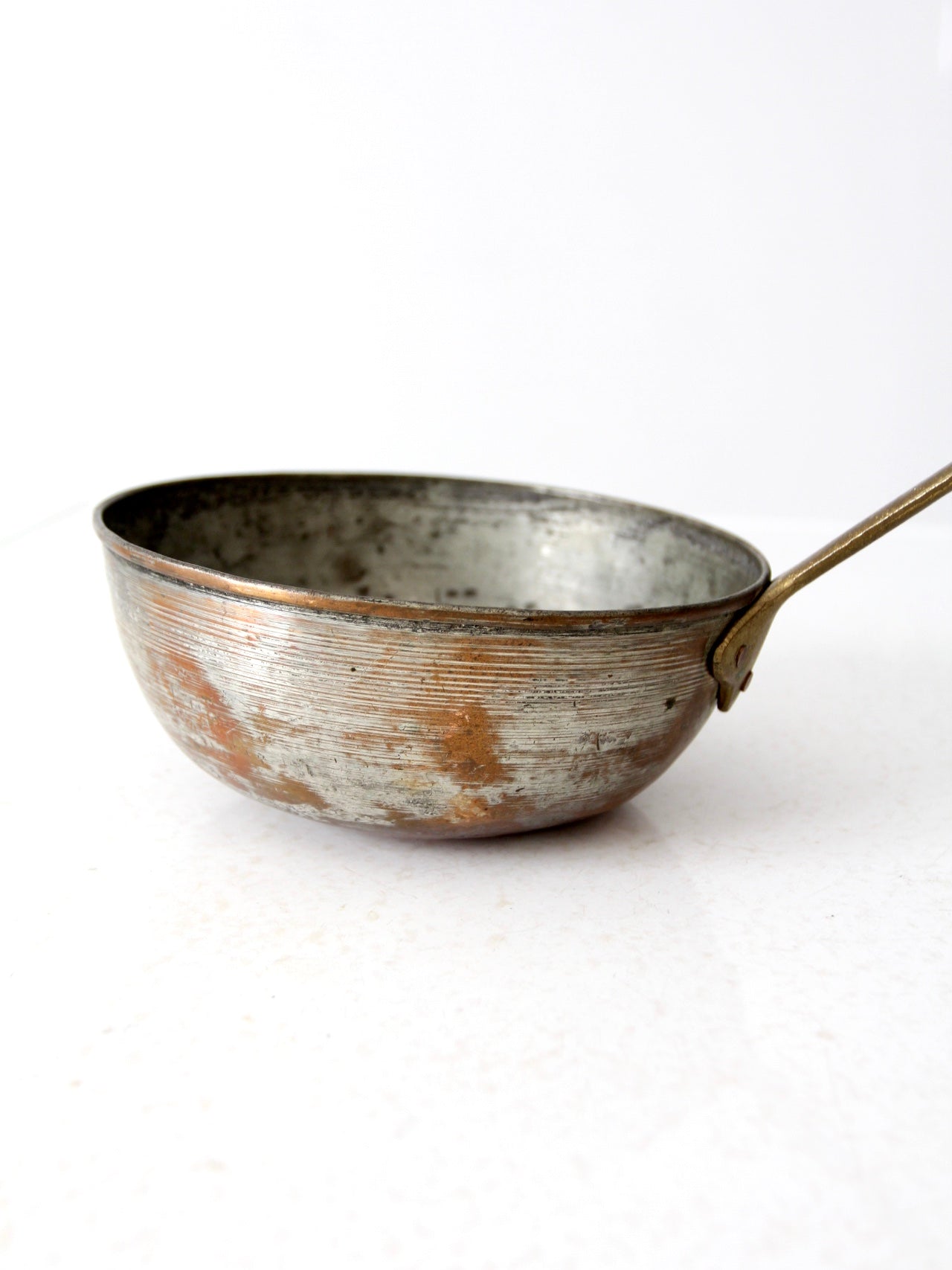 antique copper saucepan with brass handle