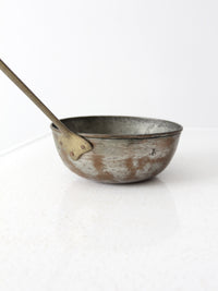 antique copper saucepan with brass handle