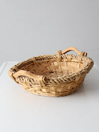 vintage wicker catchall basket with wooden handles