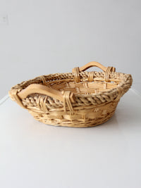vintage wicker catchall basket with wooden handles