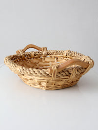 vintage wicker catchall basket with wooden handles