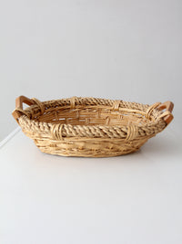 vintage wicker catchall basket with wooden handles