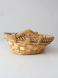 vintage wicker catchall basket with wooden handles