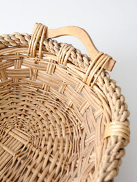 vintage wicker catchall basket with wooden handles