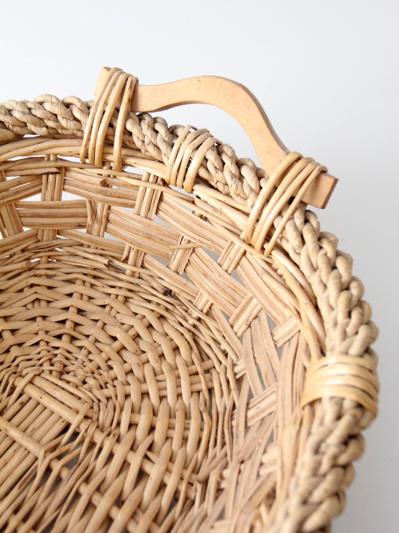 vintage wicker catchall basket with wooden handles