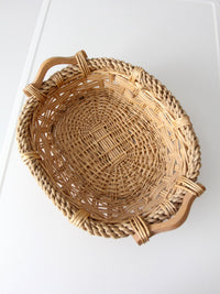 vintage wicker catchall basket with wooden handles