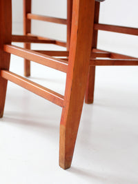 pair of 1950s wooden folding chairs with green seats