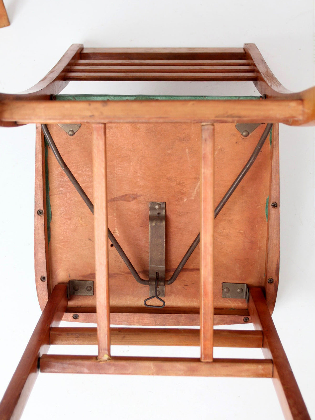 pair of 1950s wooden folding chairs with green seats