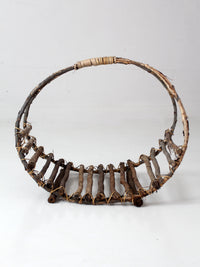 vintage rustic twig basket with arched handle