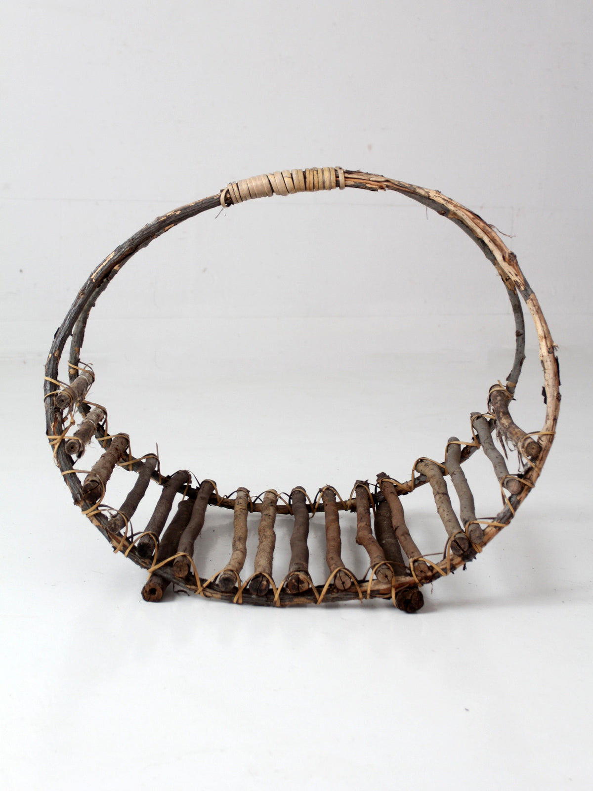vintage rustic twig basket with arched handle