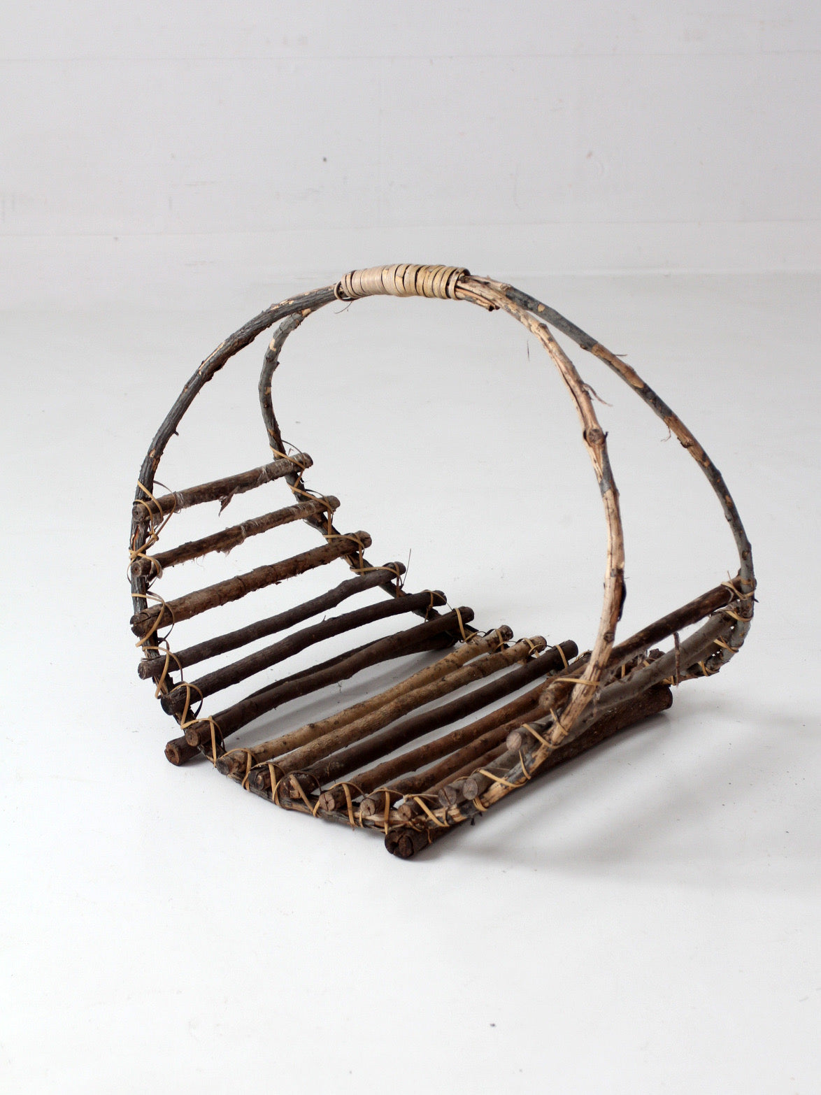 vintage rustic twig basket with arched handle