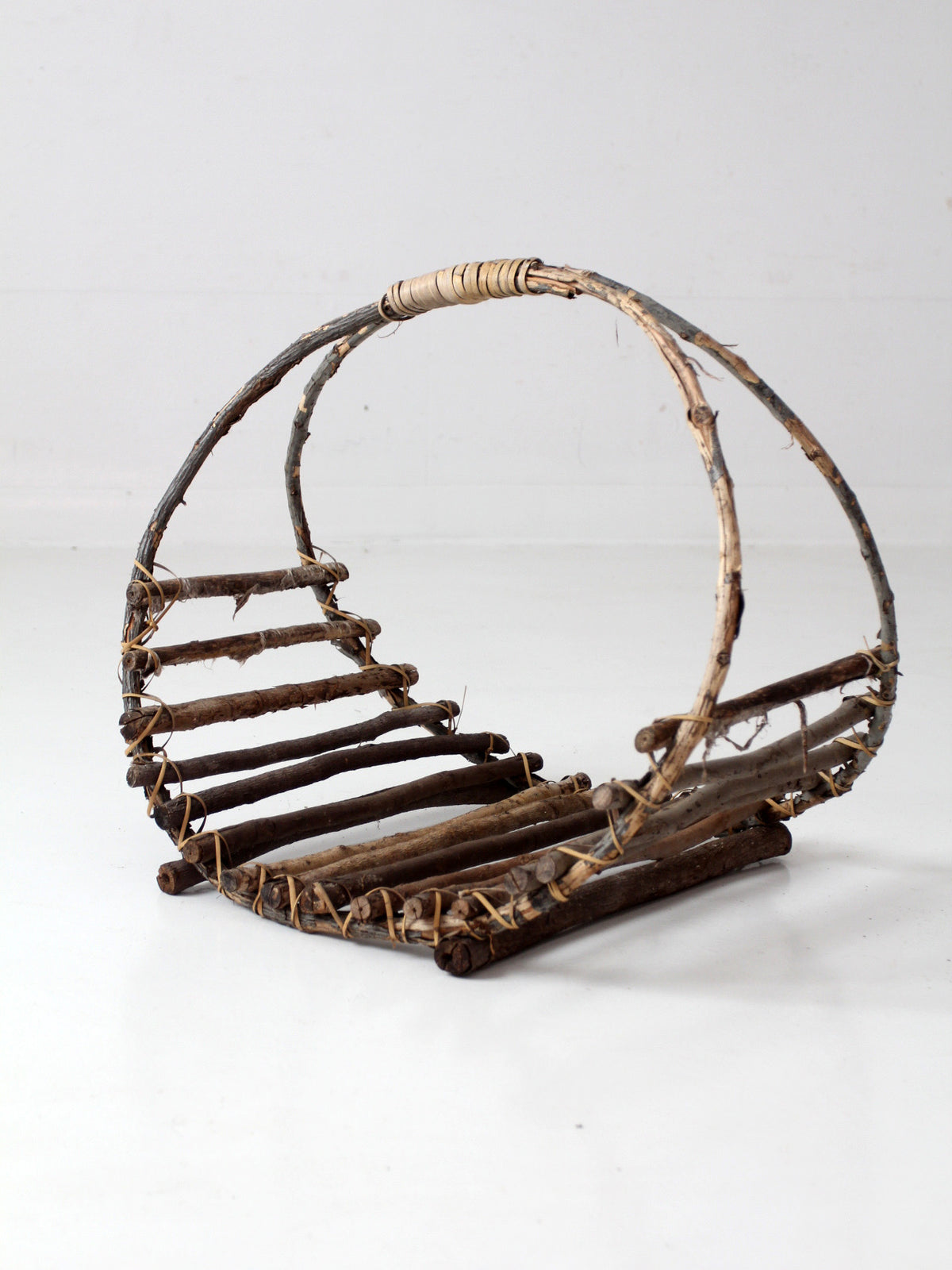 vintage rustic twig basket with arched handle
