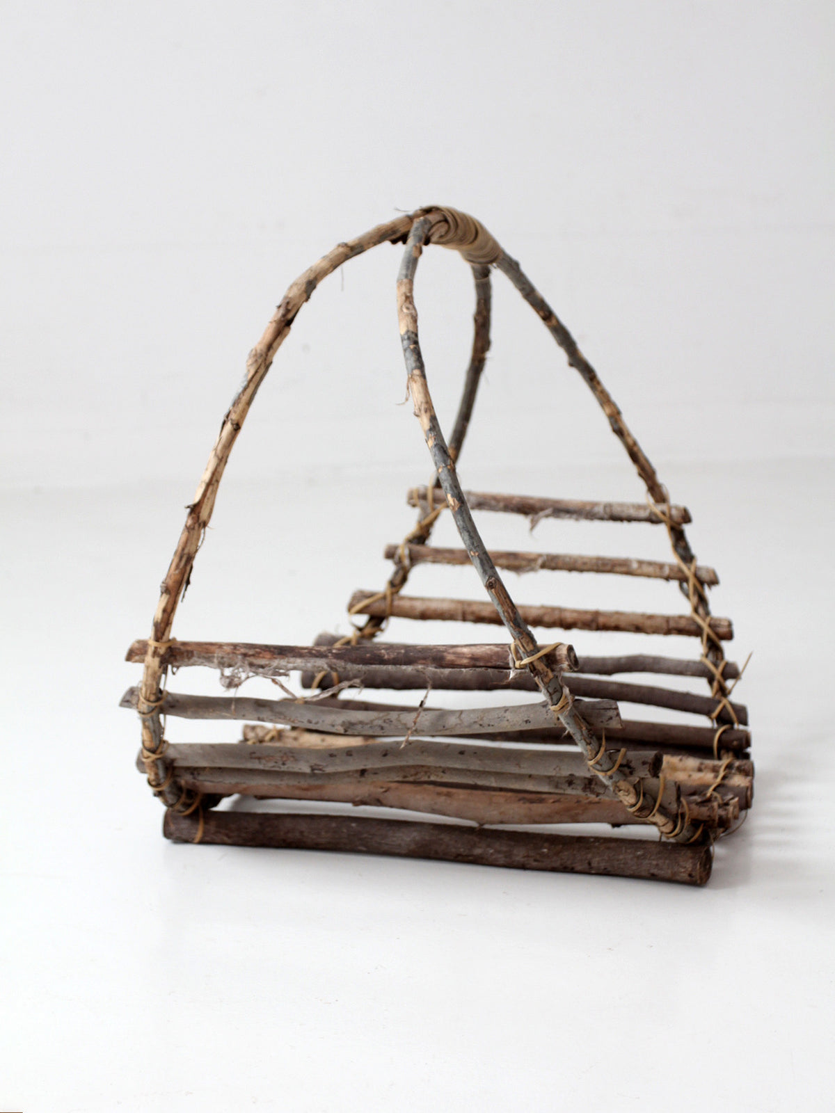 vintage rustic twig basket with arched handle