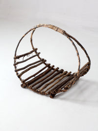 vintage rustic twig basket with arched handle