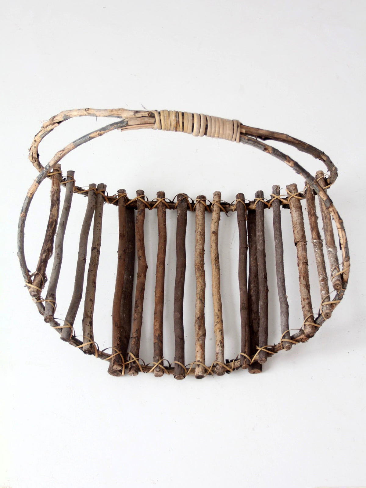 vintage rustic twig basket with arched handle