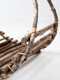 vintage rustic twig basket with arched handle