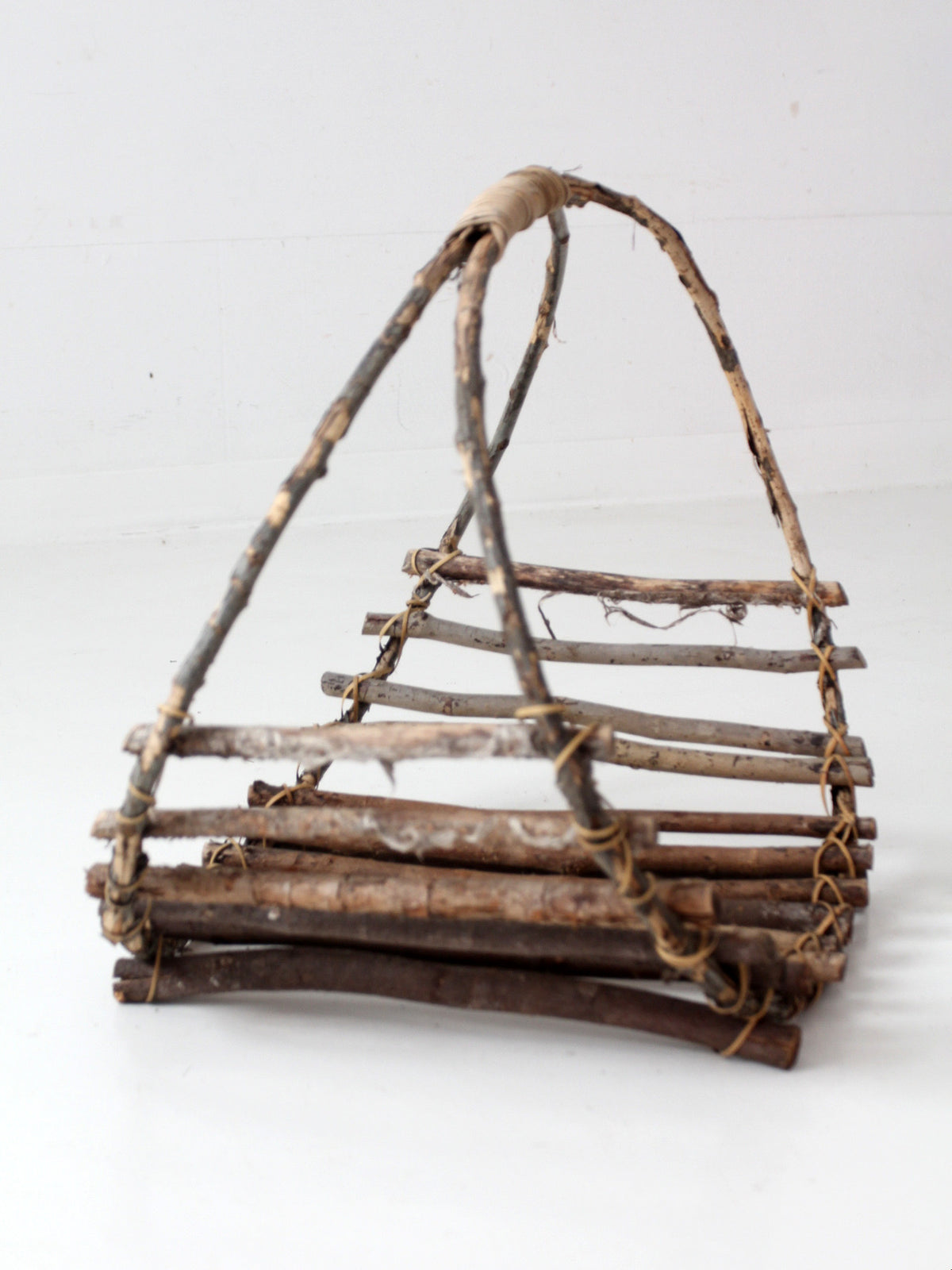 vintage rustic twig basket with arched handle