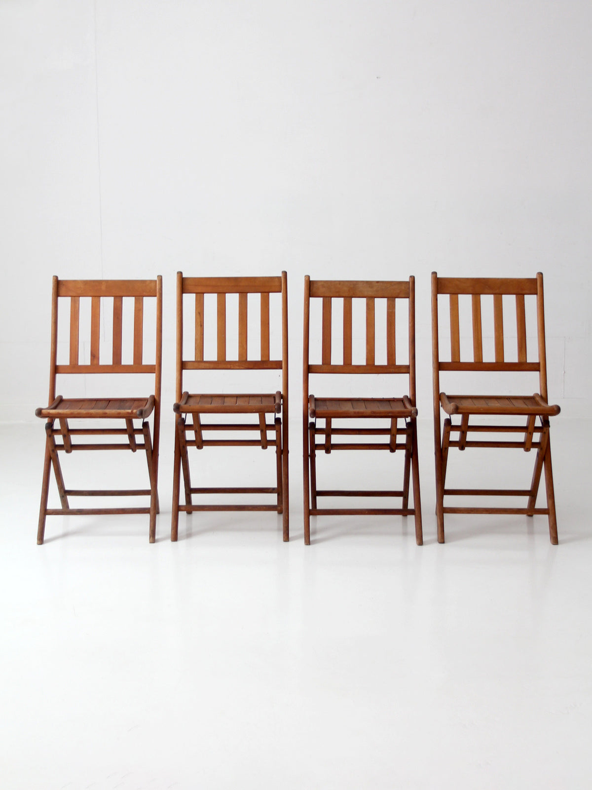 set of 4 antique slat wood folding chairs