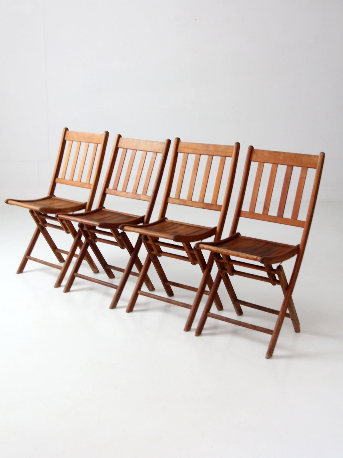 set of 4 antique slat wood folding chairs