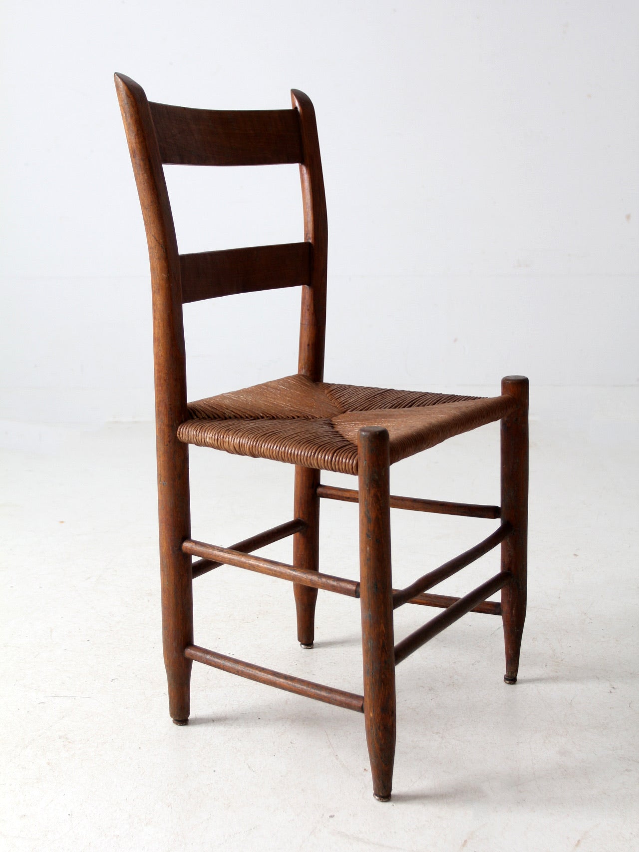antique ladder back chair with rush seat