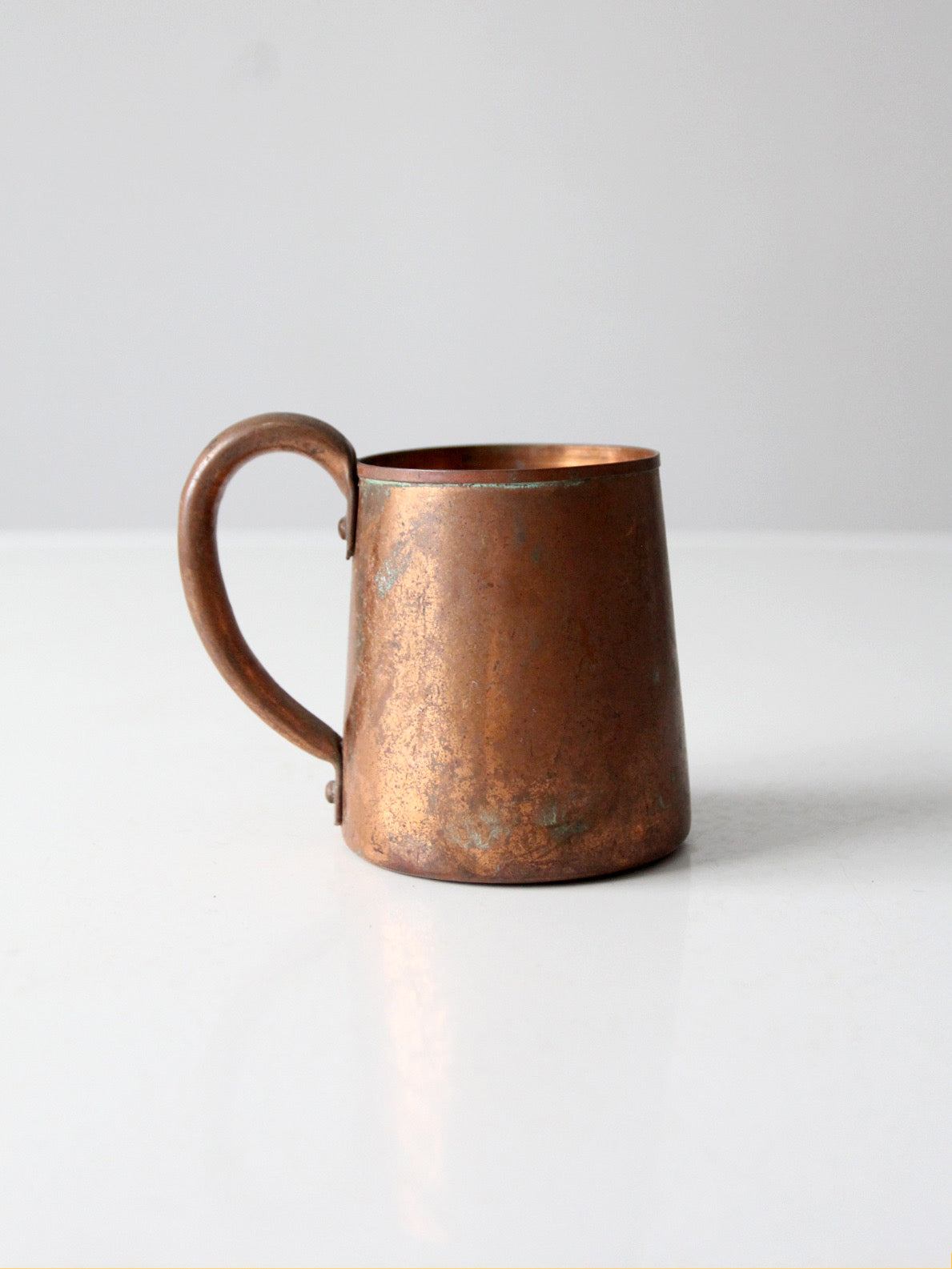 vintage copper mug with riveted handle